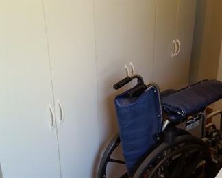 Two door storage cabinets and wheelchair