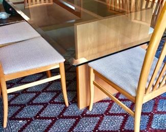 GORGEOUS WORKBENCH MODERN GLASS TOP DINING TABLE W/8 CHAIRS. MINOR CHIP ON EDGE 72" LENGTH X 42" WIDTH X 29" HEIGHT 