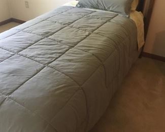. . . a nice twin bed with bedding.