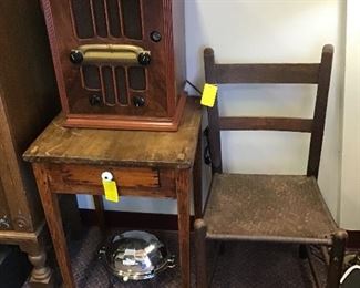Vintage radio, primitive table, bacon server and primitive chair.