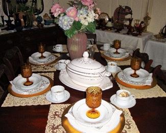 VINTAGE MAHOGANY TABLE WITH EXTRA LEAF TO EXTEND SIZE. TABLE IS SET WITH CENTURION 9414 CHINA and TIARA STEMWARE