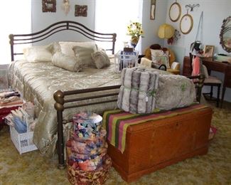 STUNNING NAUTILUS IRON KING SIZE BED with BEDDING . BUYER WILL WANT TO REPLACE THE MATTRESS, BOX SPRINGS IS FINE.