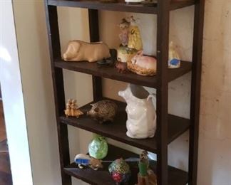 Bookcase with pig collection