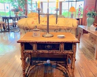 Antique English Rattan Occasional Table with Leather Top and Decorated Sides; Brass Lamp