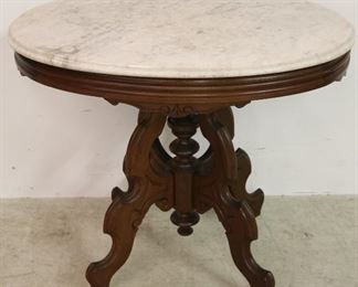 Victorian highly carved oval parlor table