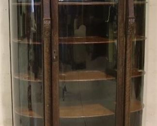 Original finish oak bow glass cabinet