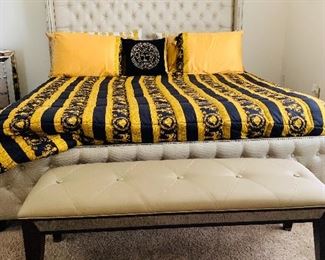 King tufted bed (bedding not for sale) and leather bench