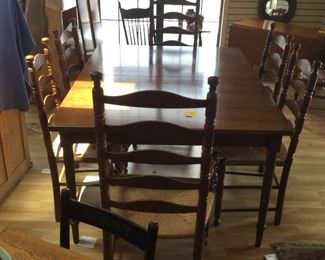 Antique Walnut table. W/ chairs and two additional leaves. 