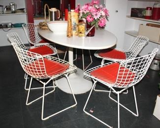 1950's "Knoll" modern design chairs, "6" all together with original red leather cushions.  Table is 1960's modern design. 