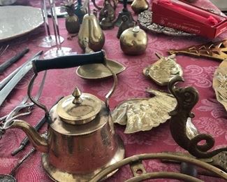 Assorted brass items and bells.