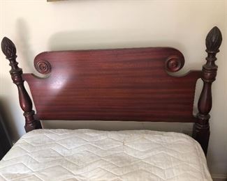 Headboard - antique twin-size pinecone bed. 