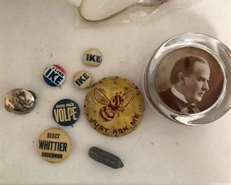 Various collection of vintage political pins and decorative pieces. 