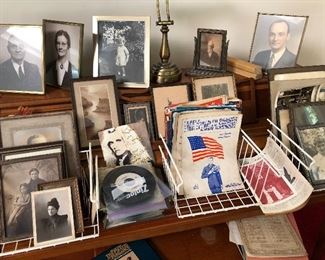 Various song books, frames, and old photographs.