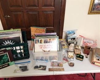 Various vintage items - costume jewelry, vinyl, paperweights, and more. 