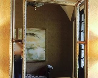 Grand Designer Mirror trimmed with 8 beveled mirror panels, ornate gold frame