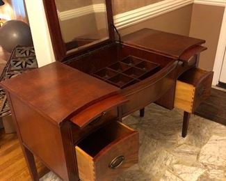 Antique Vanity table w/ lid with mirror and jewelry storage cubbies underneath lid. 