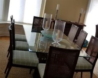 Palecek dining set with 8 chairs; glass top table and rattan base