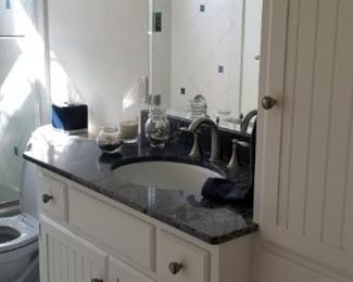 Bath vanity with matching cabinetry