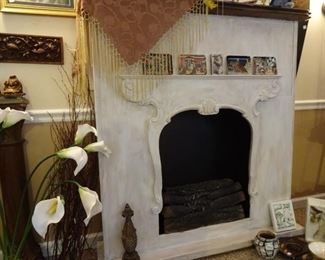 Faux fireplace with lighted vintage logs
