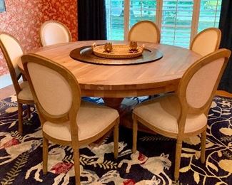 Stunning  Restoration Hardware round table with six upholstered chairs. Like new condiction 
