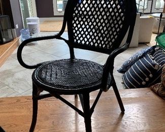 1 of 4 matching black wicker chairs 