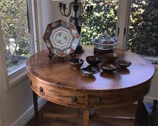 Old imari selection on a antique drum table.