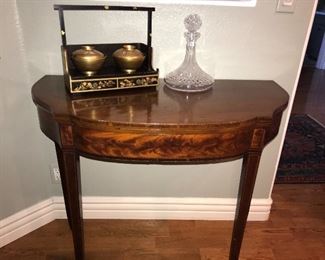 Several demilune tables/game tables here with flame mahogany