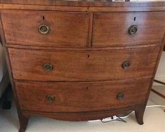 George 111 bow front chest of drawers in Mahogany with banding and original hardware