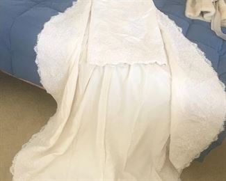 This is a custom made wedding dress in raw silk and hand made lace with beading.  Really beautiful  size 8 