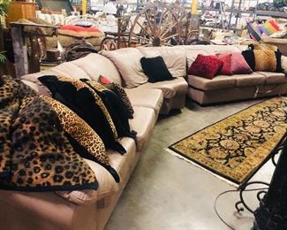 Leather sectional, Persian rug, decorative pillows