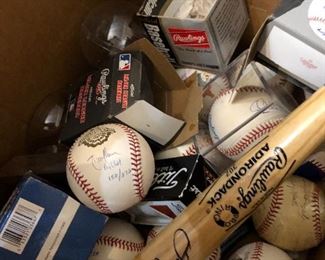 Autographed baseballs and baseball bats