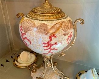 Shell motif urn on stand