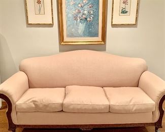 Vintage taupe camelback sofa with three down filled seat cushions.