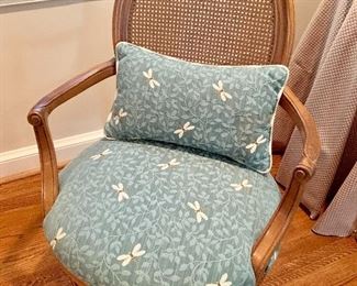 Dragonfly upholstery on can backed arm chair