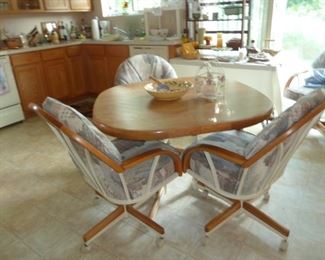 oak dinette set 4 chairs  on casters  