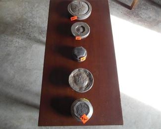 Really vintage hub caps. Five different car models.