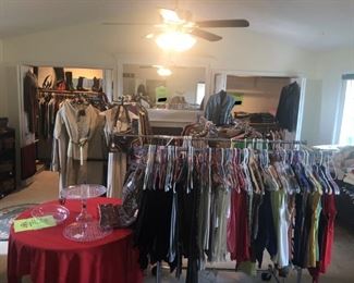 Ginni's Boutique - the room is full of clothing for women, sizes 0-8, all excellent quality and condition. Also offered is men's clothing, medium sizes. Also found are shoes, handbags, coats, gloves and more. 
