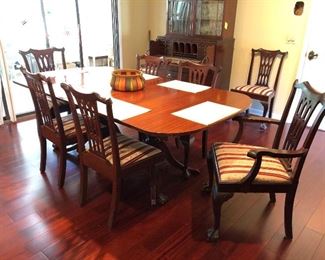 Chippendale style mahogany chairs and double pedestal mahogany table