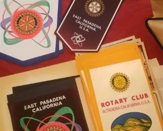 Several different vintage Rotary banners of different city clubs