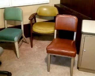 Several metal mid century office chairs