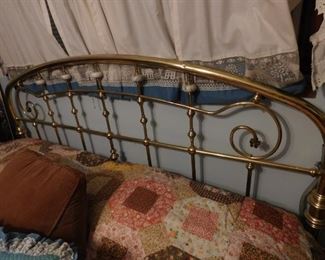 brass king headboard and bed