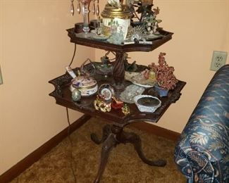 Tiered mahogany table with claw feet is the perfect corner table.