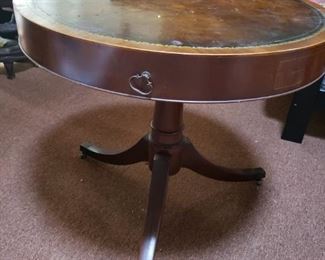 Vintage round table with leather insert. 30" across and 27" high