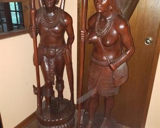 Amazing vintage teak travellers are intricately carved. Crack in basket but otherwise clean pieces. About 5' tall.