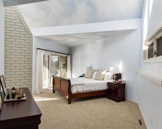 A 5 piece sleigh style king size bedroom set with bedding included.