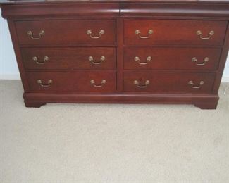 A 5 piece sleigh style king size bedroom set with bedding included.