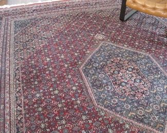 Wool area rug with diamond medallion center..