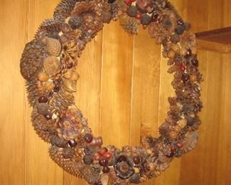A very large pine cone, nut, and pod wreath made by the owner of the house. She taught classes in the area and found additional unique pods while living in Indiana! Cones and pods not in wreaths also available!