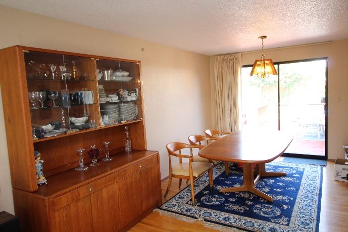 Teak cabinet and teak dining room table with 6 mid century chairs if desired.