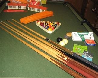 Hot Wheels race track and Thea Pool table with balls, cues, and misc other items. 